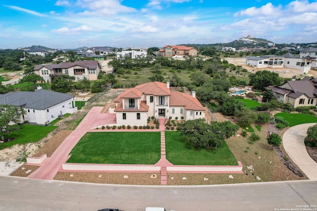 birds eye view of property with a mountain view