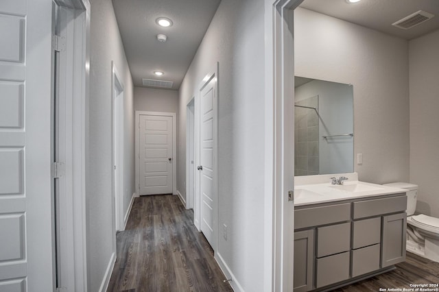 hallway with sink and dark hardwood / wood-style floors