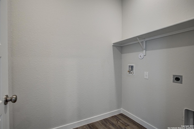 clothes washing area featuring washer hookup, dark hardwood / wood-style floors, hookup for an electric dryer, and gas dryer hookup