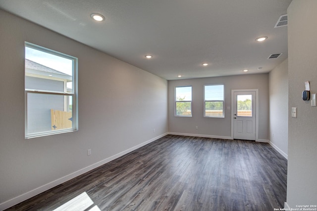 unfurnished room featuring dark hardwood / wood-style floors