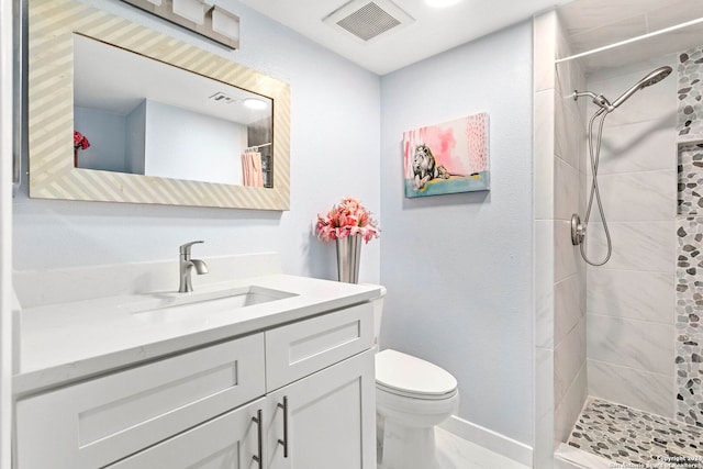 bathroom with a shower with shower curtain, toilet, and vanity with extensive cabinet space