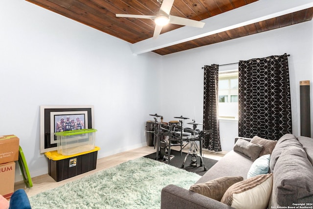 living room with beam ceiling, wooden ceiling, and ceiling fan