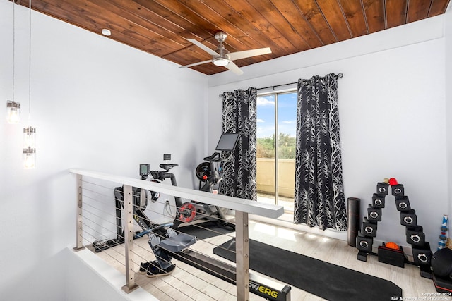 exercise room with light hardwood / wood-style floors, ceiling fan, and wooden ceiling