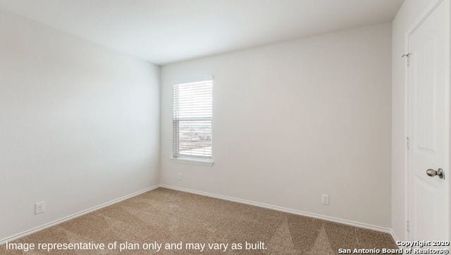 unfurnished room featuring a healthy amount of sunlight and carpet flooring