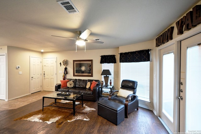 living room featuring ceiling fan, a healthy amount of sunlight, and hardwood / wood-style floors