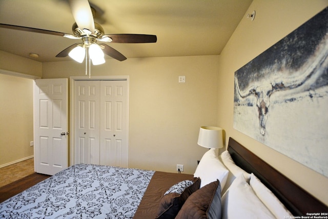 bedroom with a closet, wood-type flooring, and ceiling fan