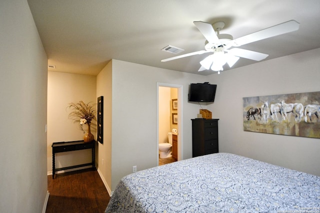 bedroom with ceiling fan, dark hardwood / wood-style flooring, and ensuite bath