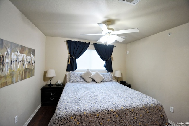 bedroom featuring wood-type flooring and ceiling fan