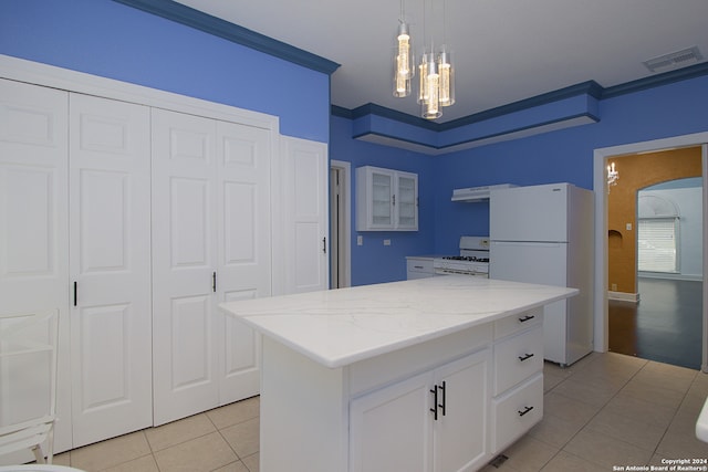 kitchen with crown molding, white cabinetry, a kitchen island, white appliances, and light tile floors