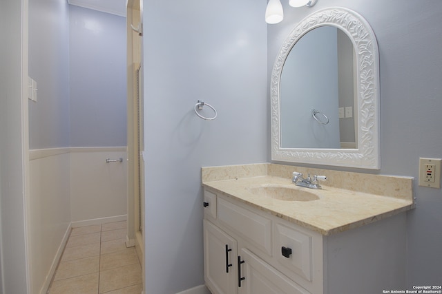 bathroom with tile flooring and vanity