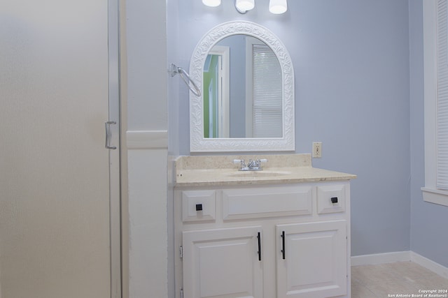 bathroom with tile flooring and vanity