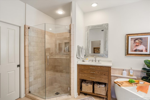 bathroom with vanity with extensive cabinet space and walk in shower