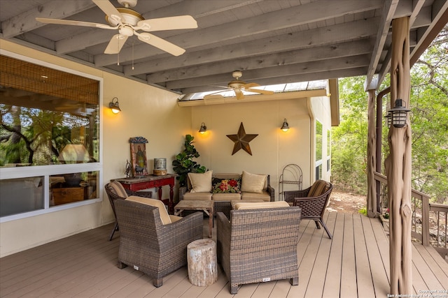 wooden deck with an outdoor hangout area and ceiling fan