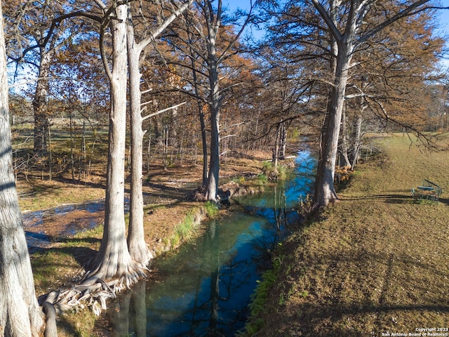 surrounding community with a water view