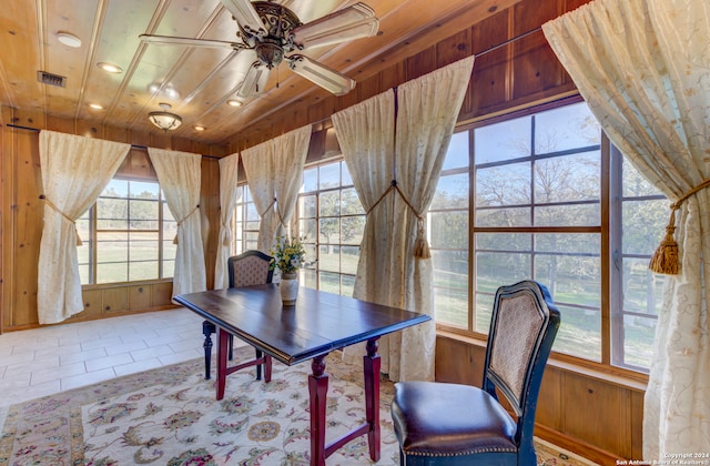 unfurnished office featuring plenty of natural light, tile flooring, ceiling fan, and wooden ceiling