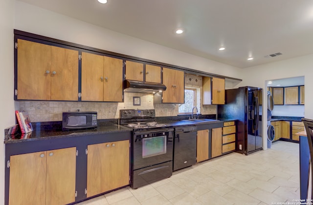 kitchen with sink, backsplash, black appliances, and light tile floors