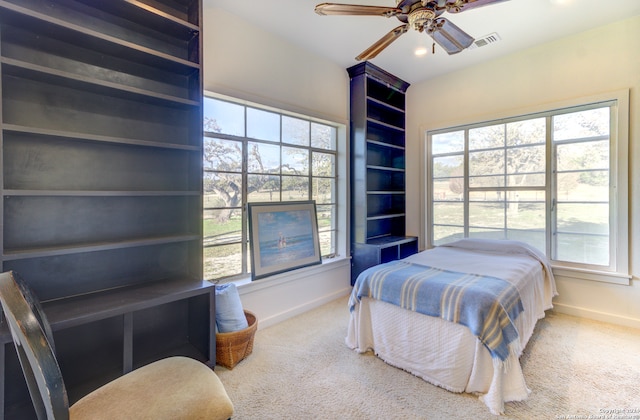 carpeted bedroom with ceiling fan