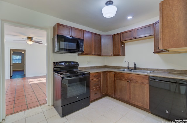 kitchen featuring ceiling fan, sink, black appliances, and light tile floors