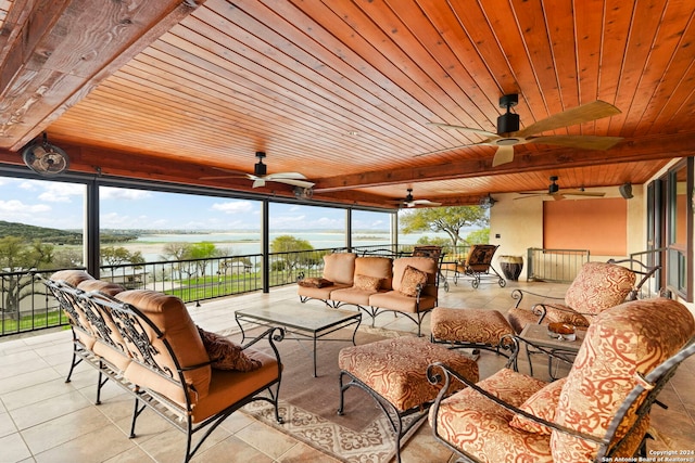 sunroom with wood ceiling and ceiling fan