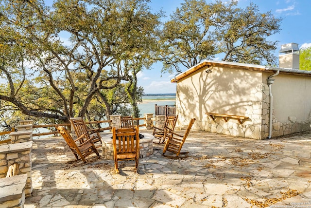 view of patio featuring a water view