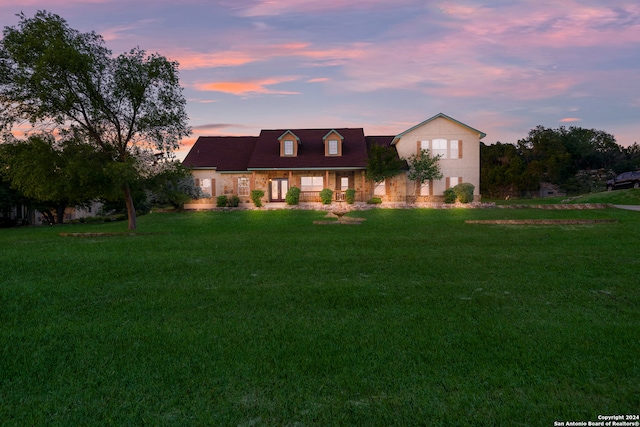 view of front of home with a yard