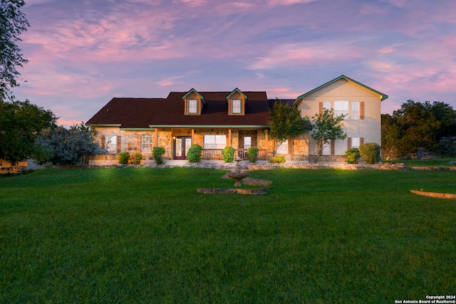 view of front of home featuring a lawn