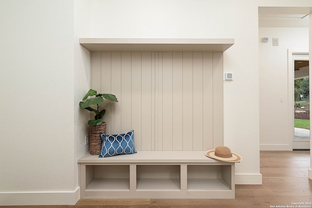 mudroom with light hardwood / wood-style floors