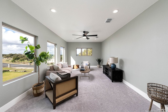 living room with carpet flooring and ceiling fan