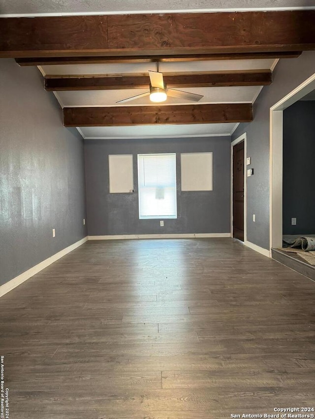 spare room featuring vaulted ceiling with beams, ceiling fan, and dark hardwood / wood-style flooring