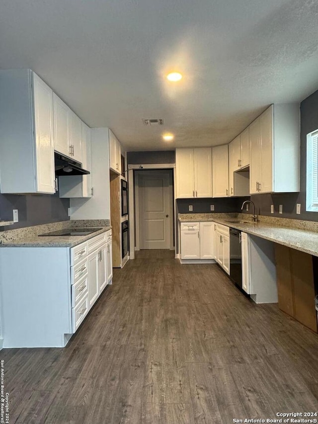 kitchen with white cabinets, dark hardwood / wood-style floors, and range hood