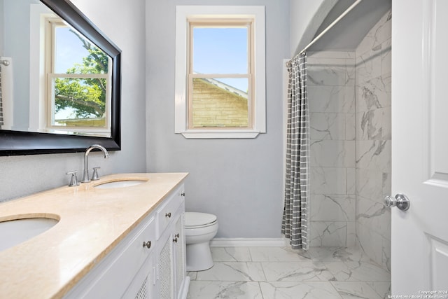 bathroom featuring vanity, curtained shower, and toilet