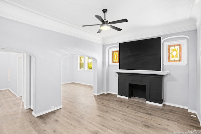 unfurnished living room featuring crown molding, ceiling fan, and wood-type flooring