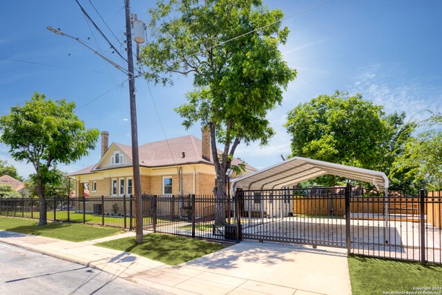 view of front of home featuring a carport