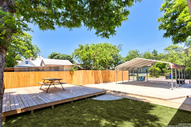 wooden terrace with a yard