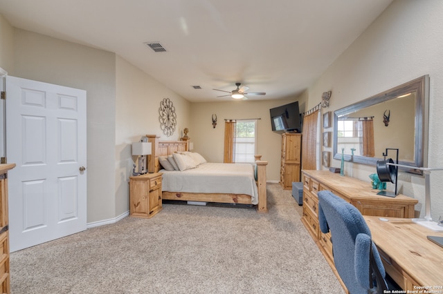 bedroom featuring ceiling fan and light carpet