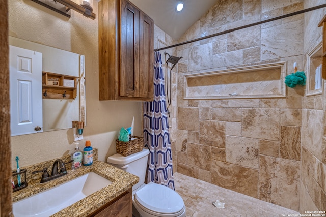 bathroom featuring vanity, lofted ceiling, curtained shower, and toilet