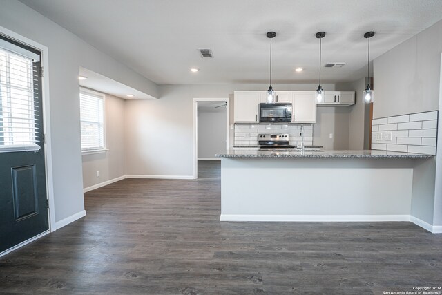 kitchen featuring decorative light fixtures, dark hardwood / wood-style flooring, stainless steel electric range oven, tasteful backsplash, and white cabinetry