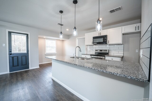 kitchen featuring hanging light fixtures, white cabinets, dark hardwood / wood-style floors, backsplash, and stainless steel electric range oven