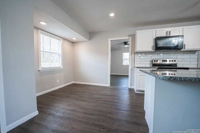 kitchen featuring white cabinets, backsplash, and dark hardwood / wood-style flooring