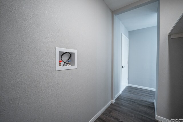 hallway with dark hardwood / wood-style floors