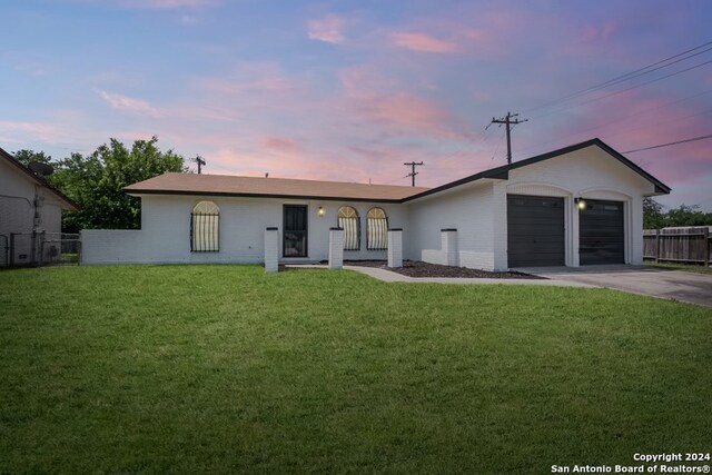 view of front of home with a yard