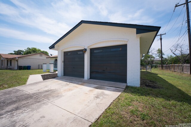 garage featuring a yard