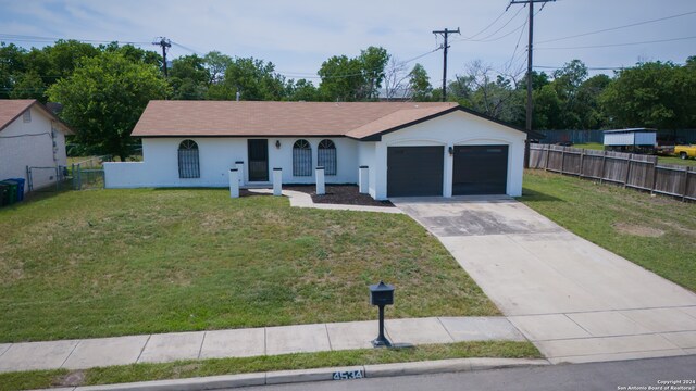 view of front facade featuring a garage and a front lawn