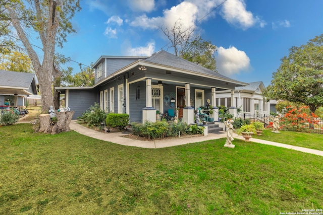 view of front of house with a porch and a front lawn