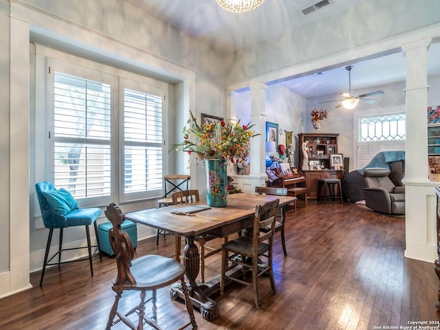 dining area featuring ornate columns, ceiling fan, and dark hardwood / wood-style flooring