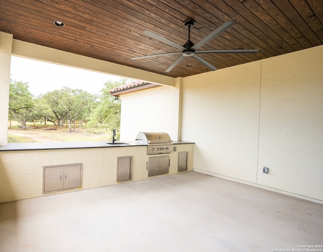 view of patio featuring a grill, ceiling fan, sink, and area for grilling