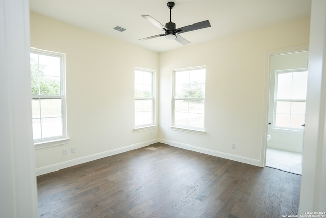 unfurnished room with dark hardwood / wood-style floors and ceiling fan