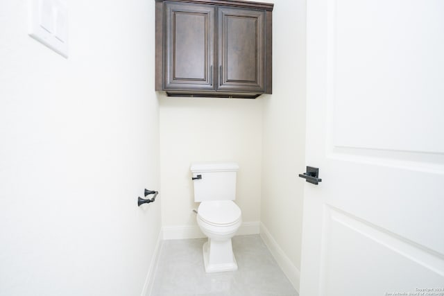 bathroom with tile patterned floors and toilet