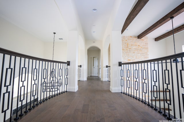 corridor with beamed ceiling and dark wood-type flooring