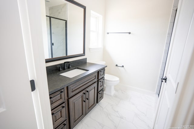 bathroom featuring vanity, toilet, and walk in shower